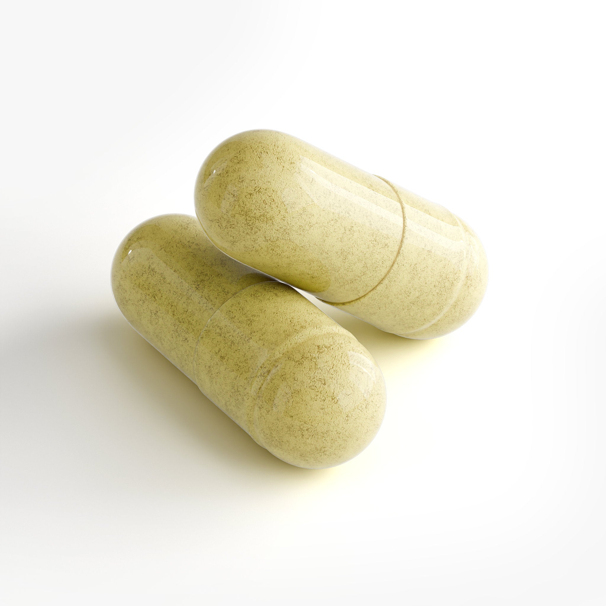 Two green capsules on a white background